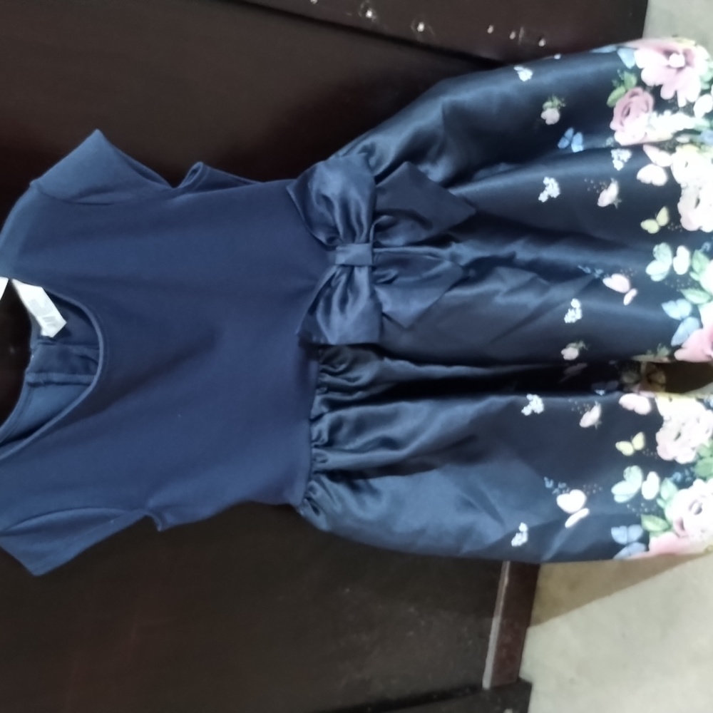 A party dress with flowers and butterflies and blue made by m and h
